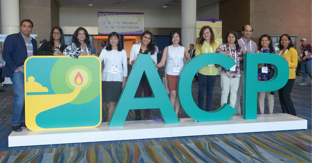 Meeting attendees pose with a larger-than-life version of ACPs logo at the Ernest N Morial Convention Center in New Orleans Photo by Kevin Berne